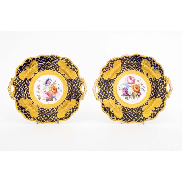 Collection of Eight French Gilt and Hand-Painted Porcelain Tableware Pieces, comprising: pair of Sevres cobalt blue and...