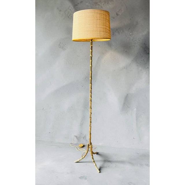 Faux bamboo floor lamp in bronze by Maison Bagues,. Sold with or without lampshades, in very good original condition with...