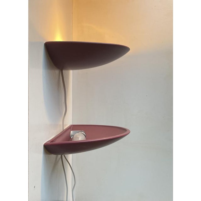 A pair of large ceramic up-light wall lights with a plum type magenta semiv-matté glaze. Manufactured in Denmark during...