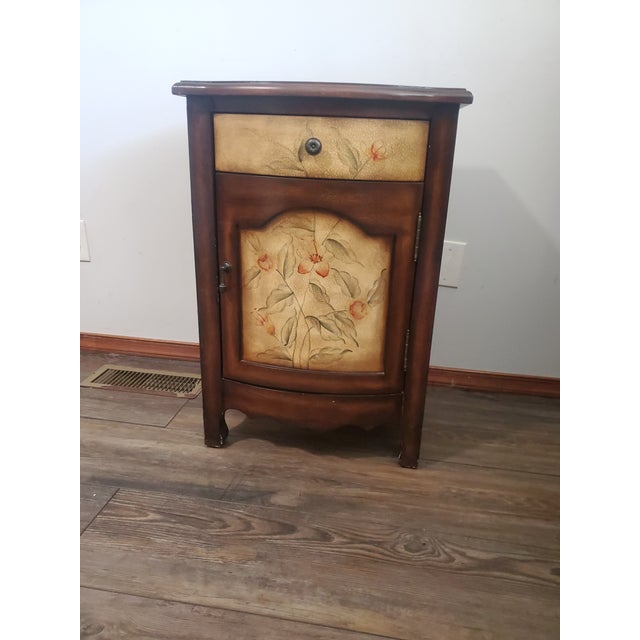 Vintage-Inspired Accent Cabinet with Hand-Painted Floral Design Add a touch of vintage charm to your home with this...