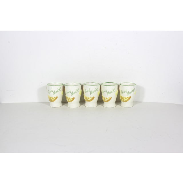 Fabulous set of five ceramic orange juice cups with raised lemon and orange slices and oranges and imprinted Good Morning....