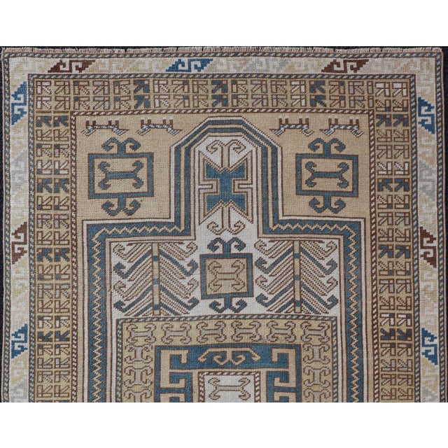 Measures: 3'5 x 5'6 Vintage Turkish Medallion Oushak Rug in Blue, Mocha, and Taupe. Country of Origin: Turkey; Type:...