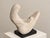 A lyrical mother-and-child sculpture designed by Pamela Pierce for Austin Productions. The mother’s long carved hair and...