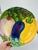 This is a colorful, hand-painted ceramic bowl made in Italy. The design features a vibrant assortment of vegetables,...