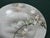 This antique Japanese dessert plate features a beautifully hand-painted image of a bird perched on a moon and tree. The...