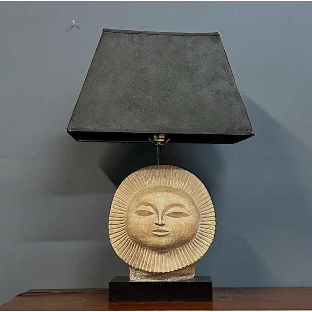 A captivating mid-century table lamp by American artist Paul Bellardo, featuring his iconic stylized sun face motif....