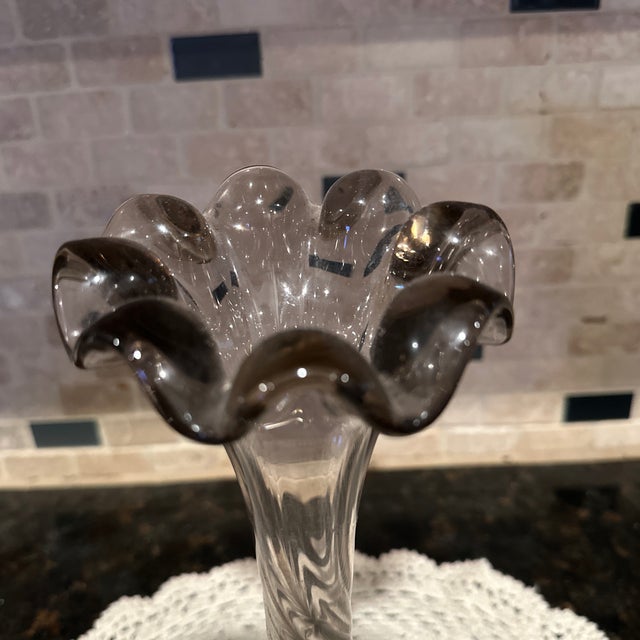 Pre owned gorgeous smoke/Gray colored. With swirl stem and ruffled rim.