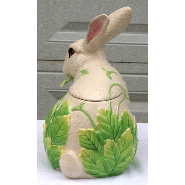 This charming cookie jar is in the form of a rabbit sitting upright with alert ears and a sweet, lifelike expression....