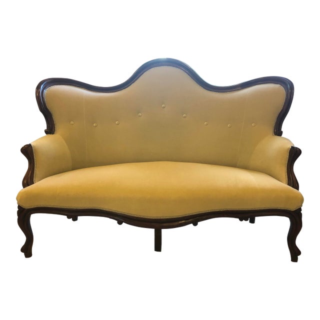 Late 19th Century Rococo Revival Carved Walnut Camelback Settee For Sale