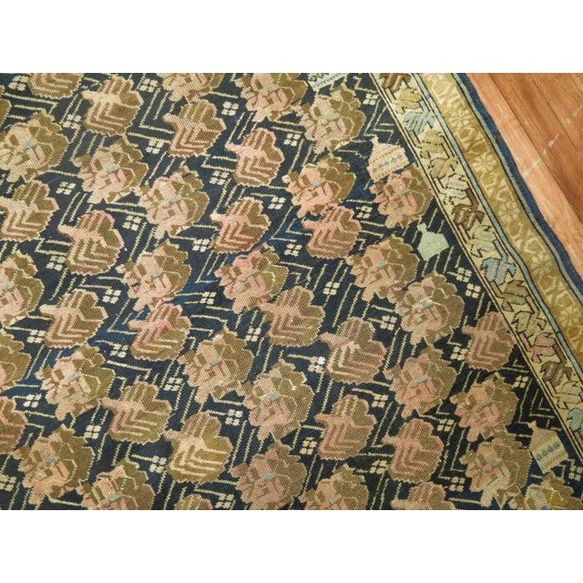 Finely woven early 20th century handmade Kuba rug in easy-going earthy palette.