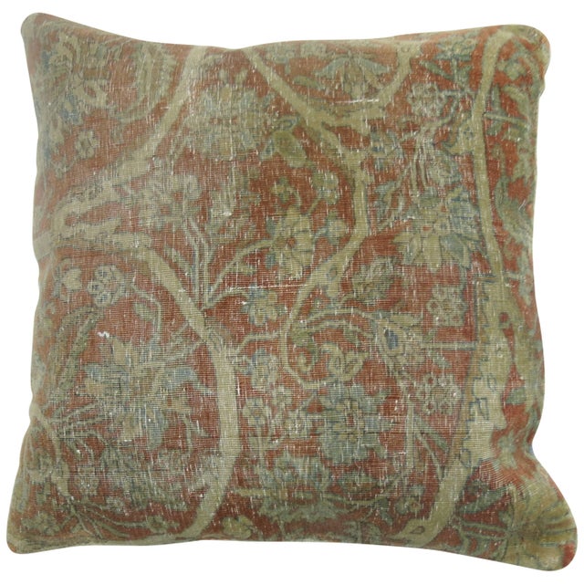 Pillow made from a shabby chic 19th century Persian Mohtasham Kashan rug backed with blue cotton. 19'' x 19''