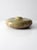 A striking vintage ceramic vase with a sculptural flattened disc silhouette and a short bottle neck that creates a bold,...