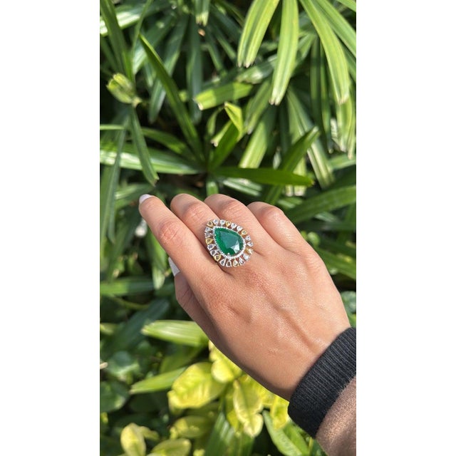 A very gorgeous and beautiful, statement style, Emerald Cocktail Engagement Ring set in 18K White Gold & natural Diamonds....