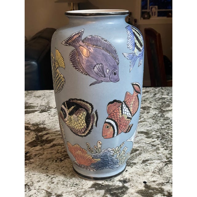 This is a gorgeous piece with very intricate tropical fish detailing. The red mark on the bottom is very blurred and is...