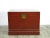 This red storage trunk is decorated with faded hand painted objects and rich patina and texture. This red Asian accent...
