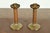 A gorgeous pair of Arts & Crafts period brass finished hand hammered copper candlesticks By Roycroft (signed with...