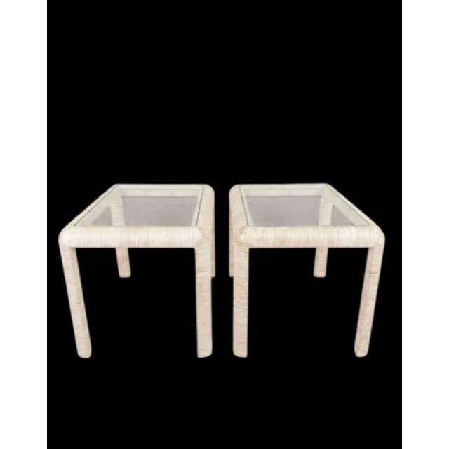 A beautiful pair of mid-century rectangular end tables, showcase a woven light tan white wash rattan texture that brings a...
