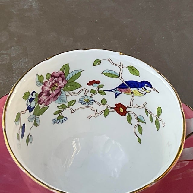 Aynsley teacup in excellent condition with a pink molded body in pink, it has the Pembroke pattern on the inside of the...