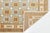 Elevate your space with this stunning Modern Khotan style area rug, expertly hand-knotted from premium wool. Combining...