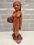 An exceptional mid-century Balinese modernist Art Deco sculpture depicting a traditional harvest maiden. Standing 11.5...