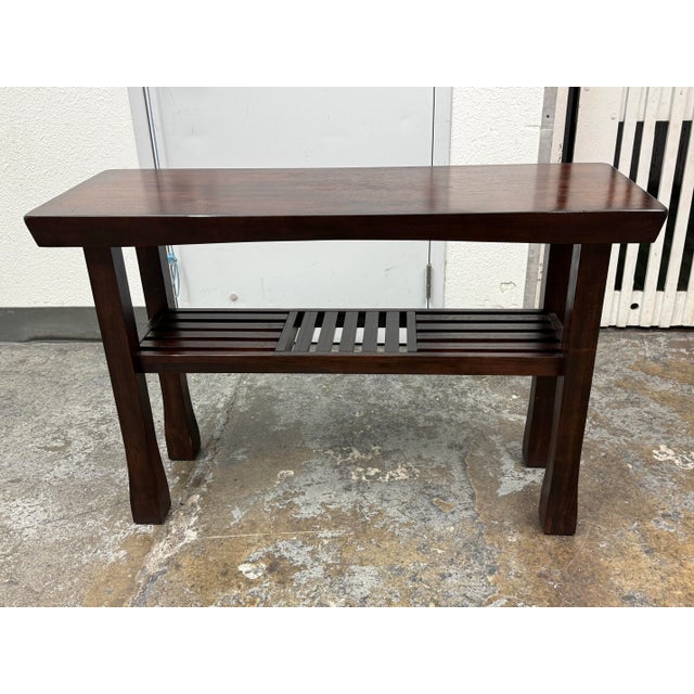 Design Plus Gallery presents a Hako Collection Console Table from World Market. The tobacco stained console has an...