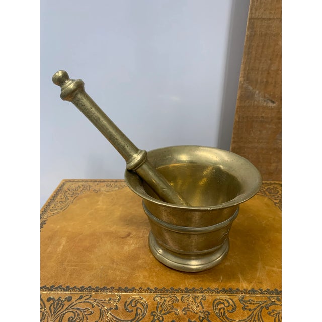 Polished Antique Brass Mortar with Original Pestle Bowl = 5” Diameter x 3.75”H Pestle = 8.5”L x 1.75” D