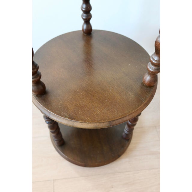 Pretty vintage side table in turned wood. with its three levels, it is very practical for placing plants or books. Note...
