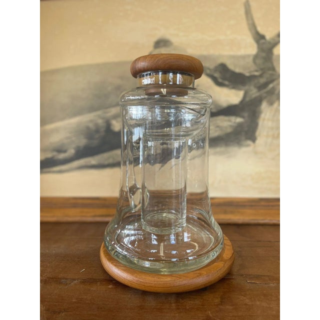 Pitcher is Glass or Similar Material. Teak Base and Lid have Makers Sticker as Pictured. Inner Layer of Pitcher can be...
