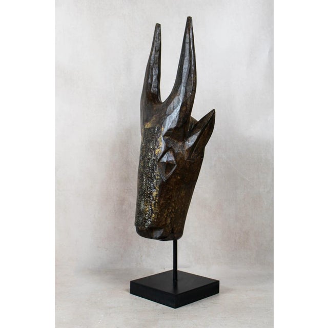 Malian bull mask with repoussé metal work ​bring a bold, grounding energy to your interior with this exceptional bull mask...