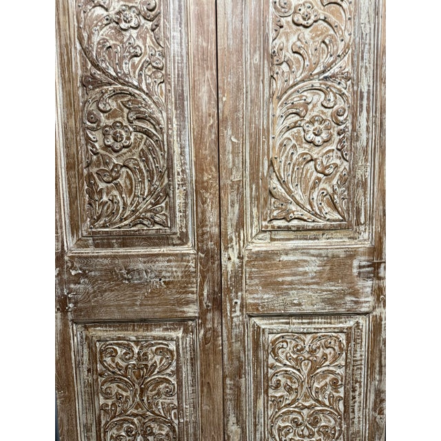 Add historic charm and architectural character to your space with these antique hand-carved floral barn doors. Crafted...