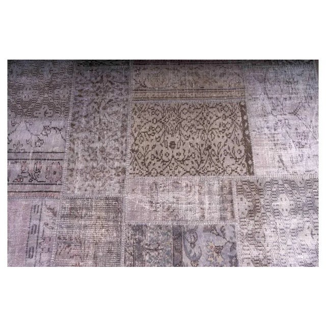 Middle Eastern rectangular rug made from various rug parts (perimeter edge slightly unstitched) MEASURES Width 170cm Depth...