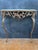 Exceptional neoclassical style console table crafted in gilt bronze with a marble top, dating to the mid-20th century. The...