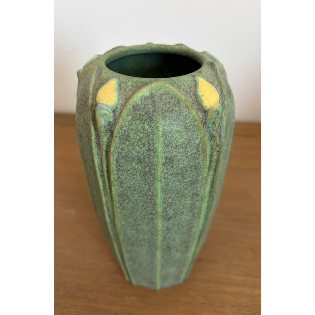 Jemerick Arts and Crafts Pottery vase, approximately 9 inches tall, with a matte green glaze, sculptural vertical leaf...