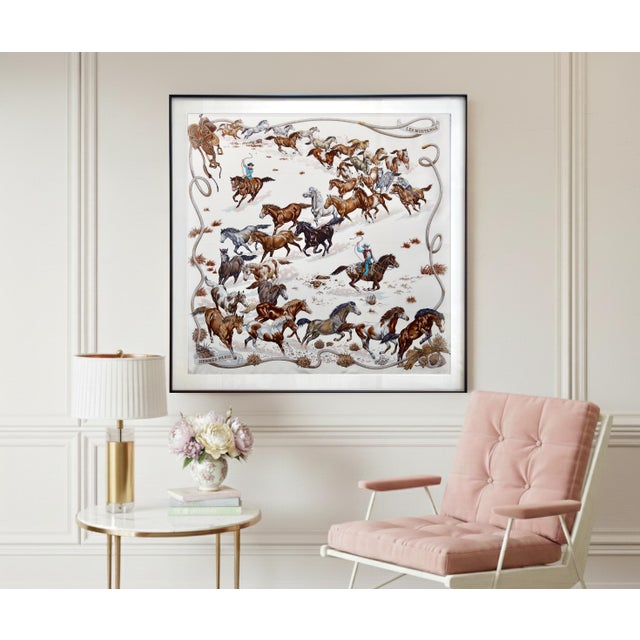 This beautiful art piece is an authentic framed Hermès scarf. Designed in 1993, "Les Mustangs" is a classic Hermès motif...