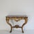 A 19th century Louis XV style wall console table with marble top. Probably from the Napoleon III epoch. Gesso and gold...