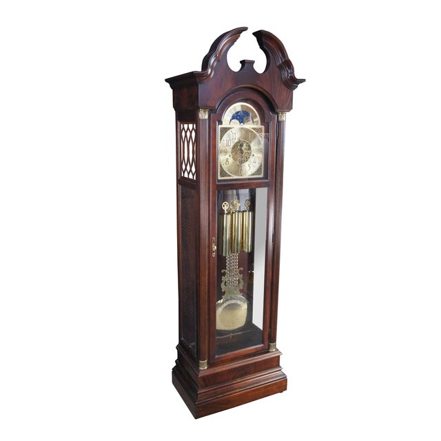 Late 20th century Howard Miller 610-376 Grandfather Clock, serial number 592902. Features a tall Georgian style case made...