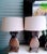 A beautiful pair of pineapple shaped table lamps. The lamps appear to be made of wood at first glance but they are in face...