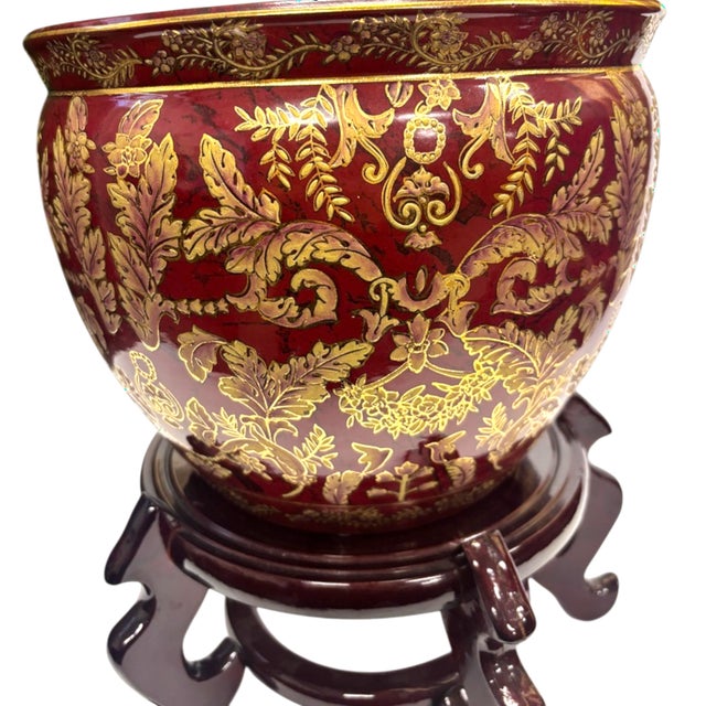 A very fine large Mid-Century Asian ceramic planter on laquered wood stand. This vase features hand painted acanthus...