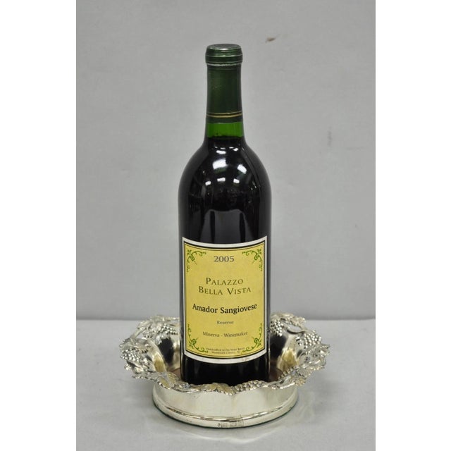 Vintage English Victorian Wood and Silver Plated Grapevine Repousse Wine Bottle Coaster. Circa Mid 20th Century....