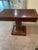 American Empire Style Console or Game Table. Mahogany with square top that folds in half on a pedestal base. No storage...