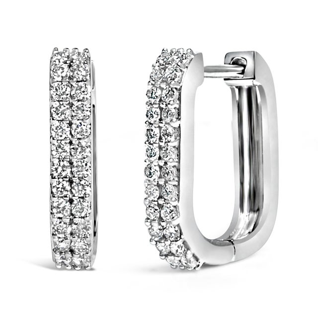 Discover a touch of timeless elegance with these lustrous 10K white gold huggie hoop earrings, carefully crafted to...
