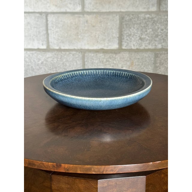 A unique bowl designed by Carl Harry Stålhane for Rörstrand. Bowl features a unique baby blue color palette with details...