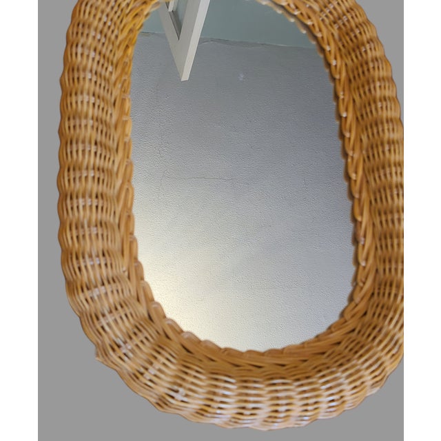 Add a touch of coastal tropical vibe to your home decor with this beautiful oval wall mirror. The mirror is accentuated by...