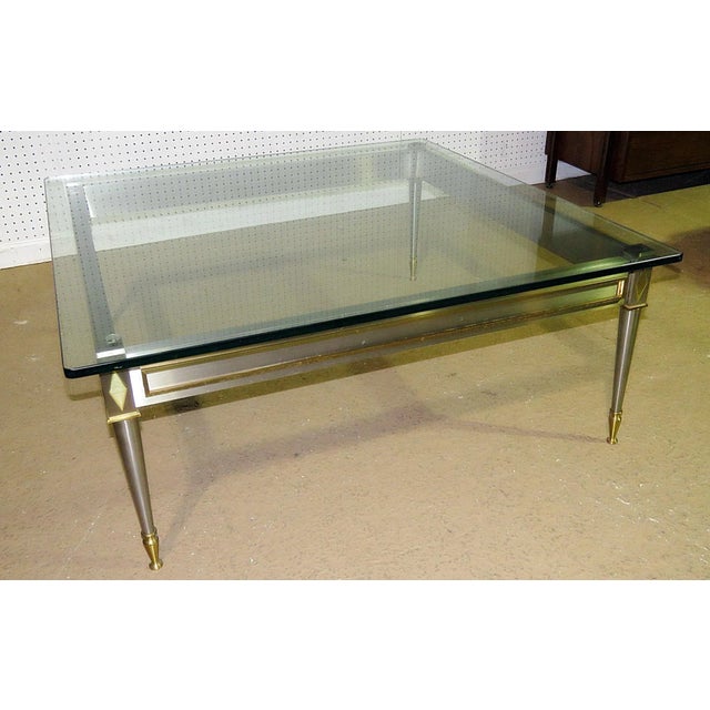 This Rare Square Steel Brass French Directoire John Vesey Style Coffee Cocktail Table is a striking blend of neoclassical...