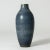 Statuesque stoneware floor vase by Carl-Harry Stålhane, in a clean form with beautiful blue glaze with a somewhat grainy...
