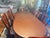 Beautiful, high-quality traditional dining room table in excellent condition. This table features a rich reddish-brown...