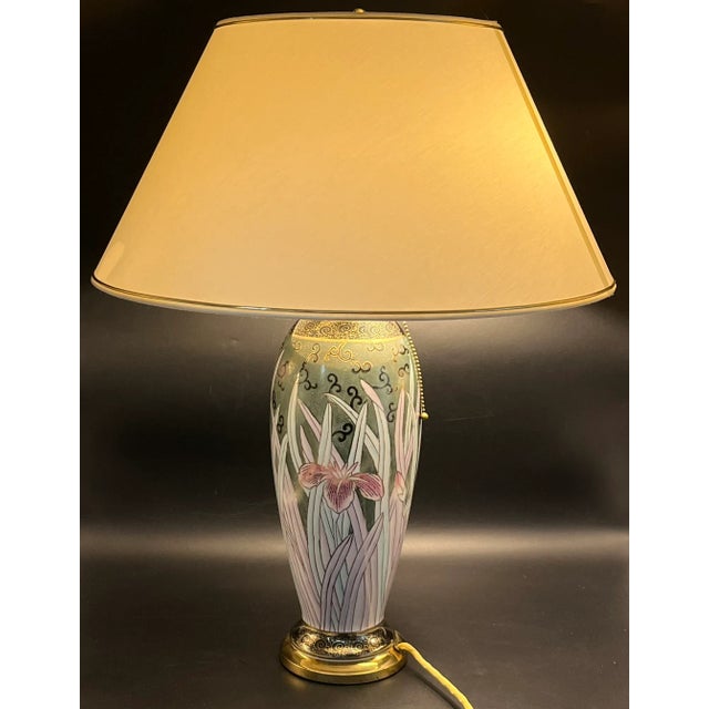 This impressive table lamp combines classic Far Eastern aesthetics with mid-century functionality. The tall, elegantly...