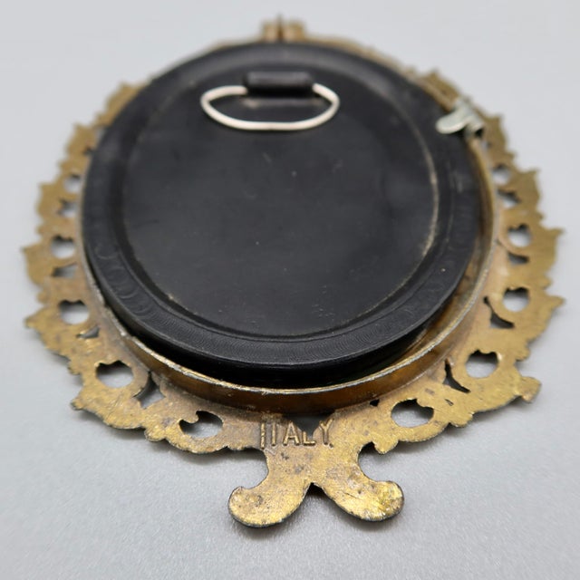 Beautiful mid-century miniature Italian cast metal picture frame featuring graceful swirling designs and a warm bronze-...