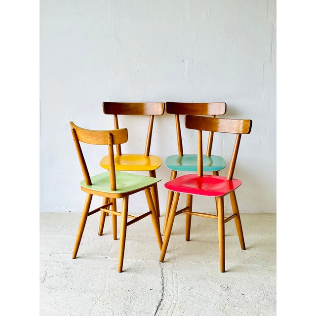 The chairs are in excellent original condition and are strong and stable. Two chairs were painted in the past and two seem...