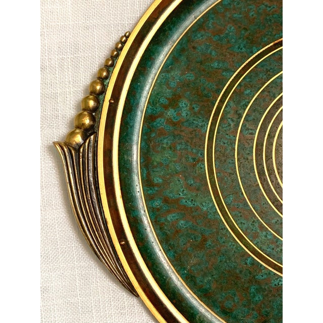 Striking Swedish Art Deco tray designed by Carl Sørensen, crafted in bronze with a richly textured verdigris enamel...